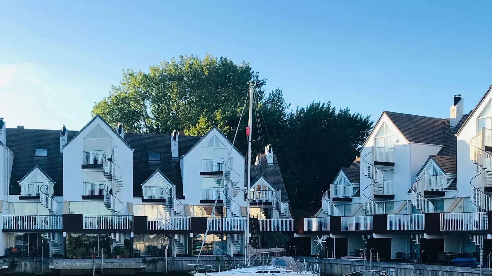 Waterside homes reflected in Christchurch Harbour
