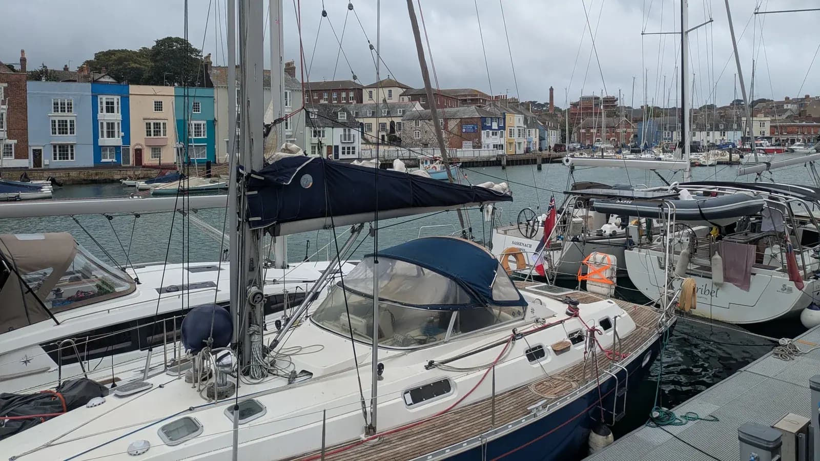 Sailing boats and colourful buildings around Weymouth Harbour