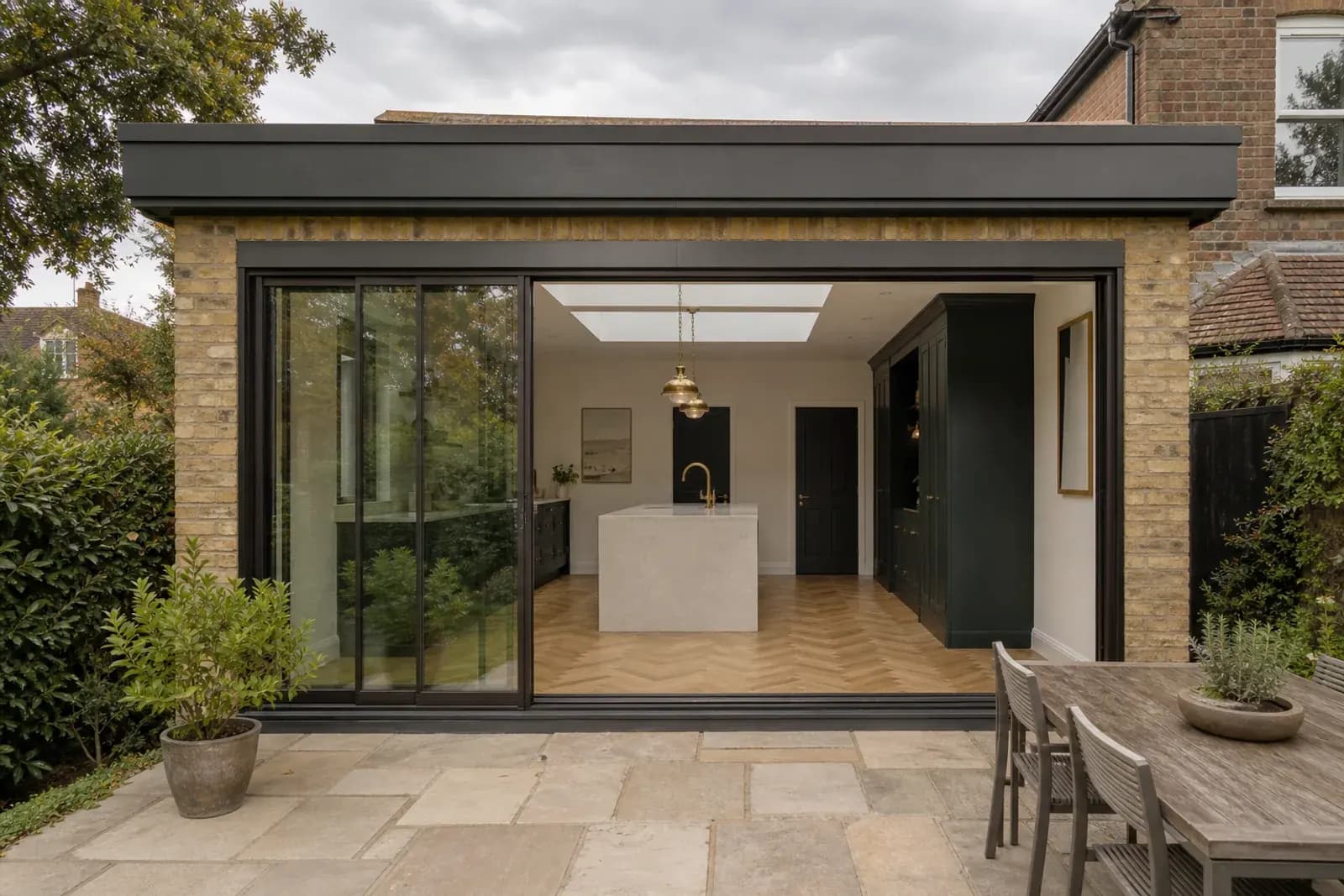 Rear garden opening into a completed kitchen extension